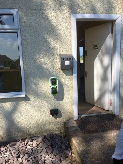 EV charge point outside door of Strathaven Airfield clubhouse